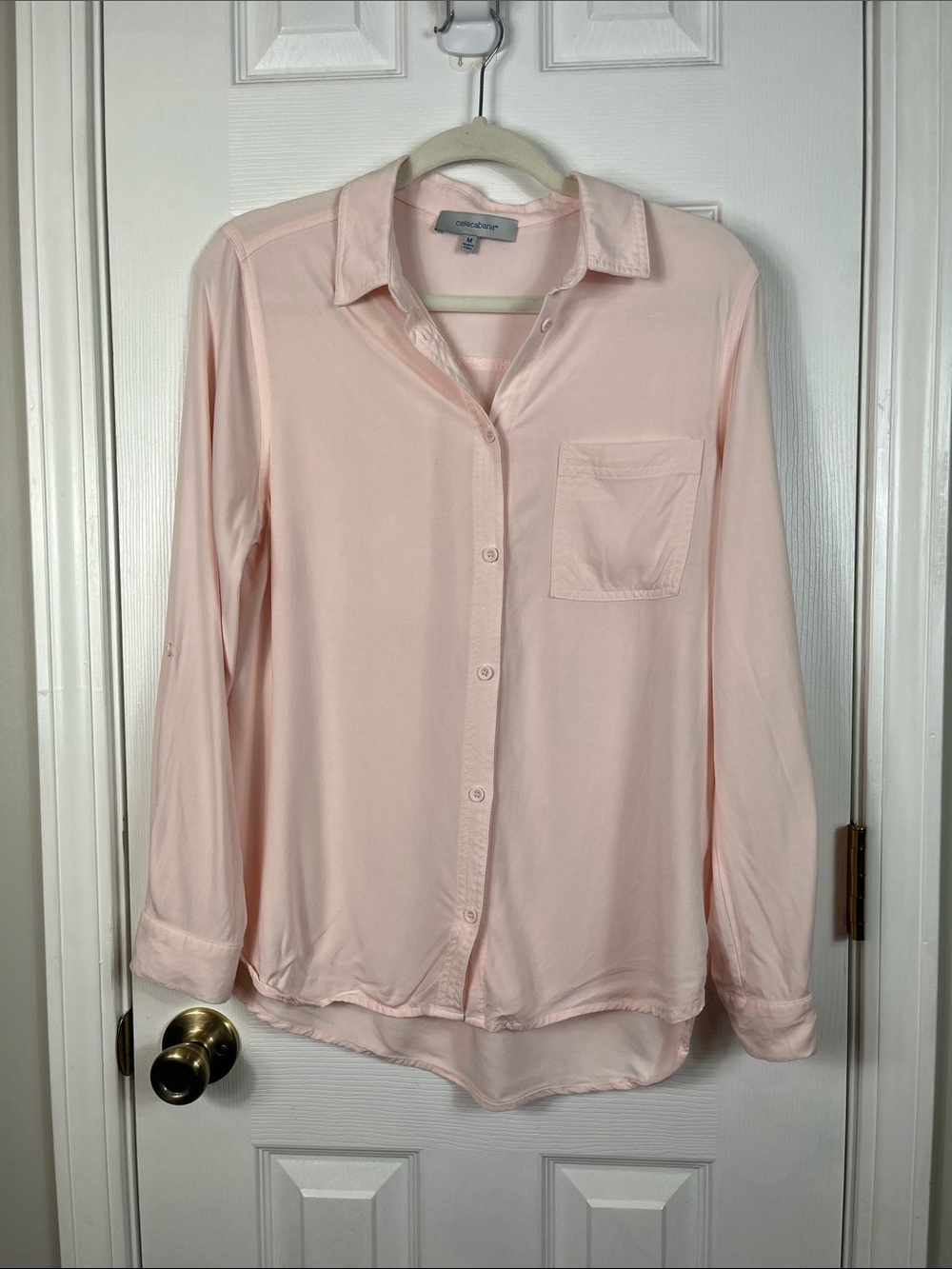 Casacabana light pink long sleeved button down shirt size Med. 100% rayon.